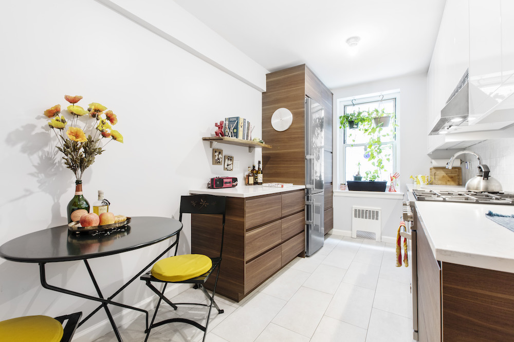 Galley kitchen with small dining area