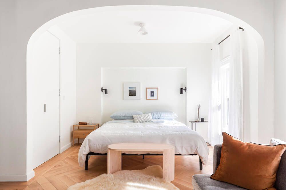 brownstone remodel master bedroom with arched entry